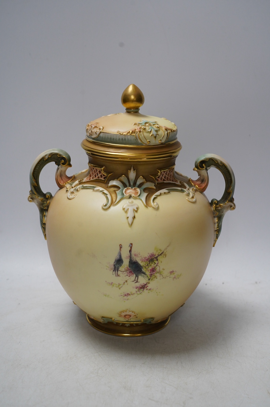 A Worcester jar and cover, 1515, painted with turkeys by Charles Baldwyn, 25cm high. Condition - fair, one handle repaired